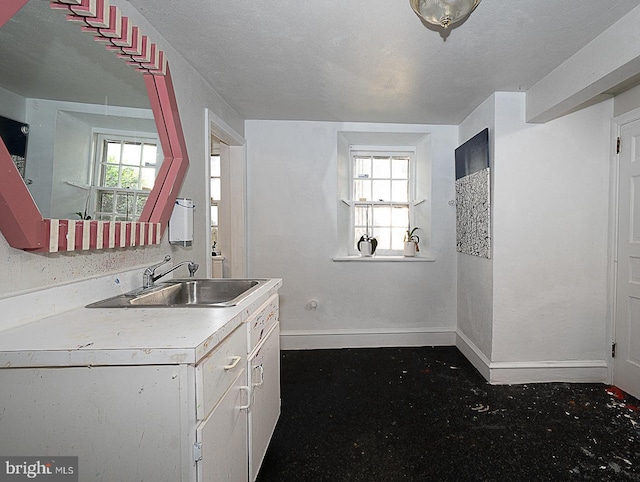 701 Argyle Rd, Wynnewood, PA 19096 - kitchen featuring a sink, baseboards, and light countertops