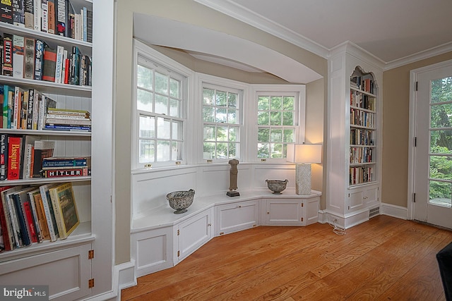 701 Argyle Rd, Wynnewood, PA 19096 - sitting room with crown molding, light wood-style flooring, healthy amount of natural light, and built in features
