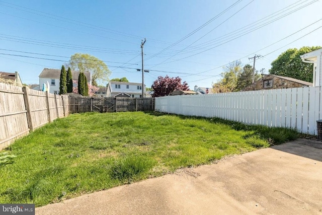 view of yard with a fenced backyard