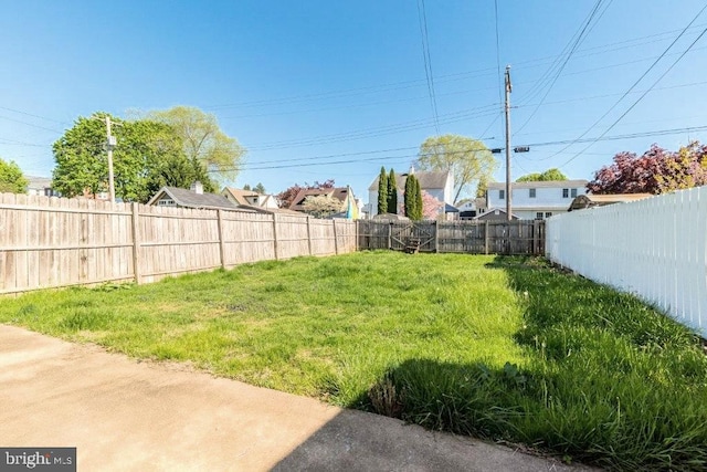 view of yard with a fenced backyard
