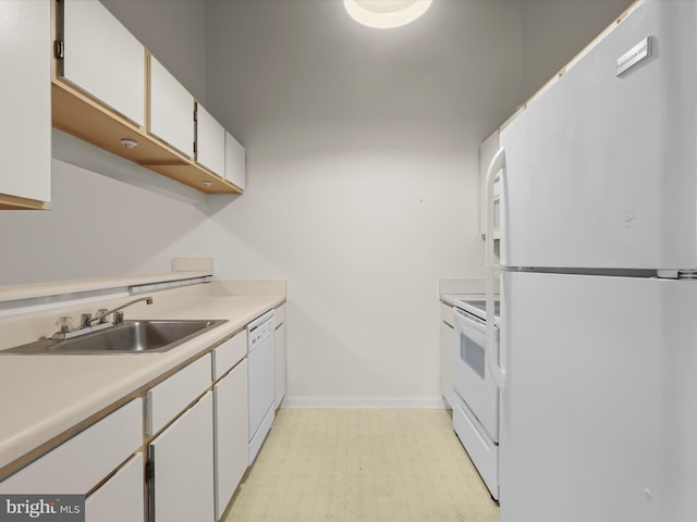 6605 Rapid Water Way Unit 301, Glen Burnie, MD 21060 - kitchen featuring white appliances, a sink, white cabinets, light countertops, and light flooring