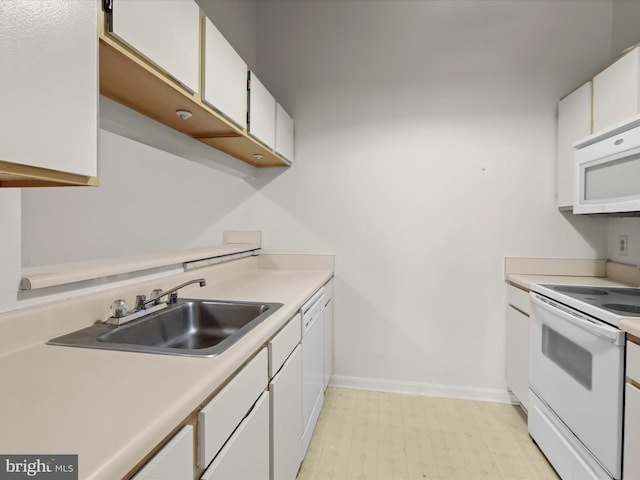6605 Rapid Water Way Unit 301, Glen Burnie, MD 21060 - kitchen featuring white appliances, a sink, white cabinetry, and light countertops