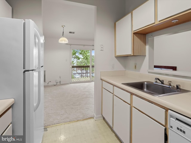 6605 Rapid Water Way Unit 301, Glen Burnie, MD 21060 - kitchen featuring white appliances, a sink, light carpet, and light countertops