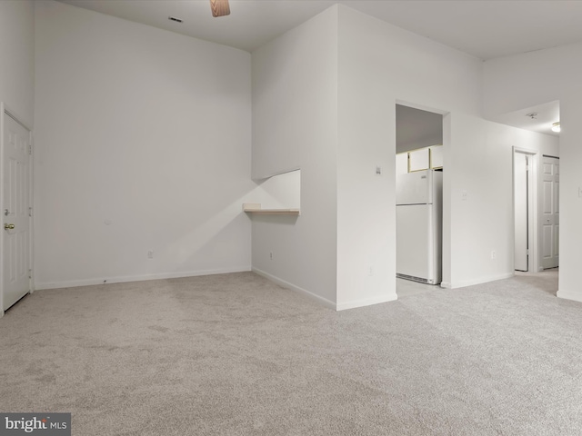 6605 Rapid Water Way Unit 301, Glen Burnie, MD 21060 - unfurnished living room with light carpet and baseboards