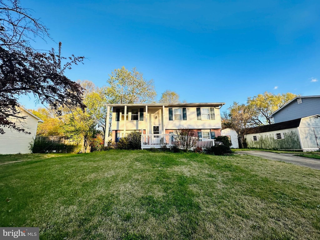 7 Mooncoin Cir, Waldorf, MD 20602 - view of front of property with a front yard, brick siding, and covered porch