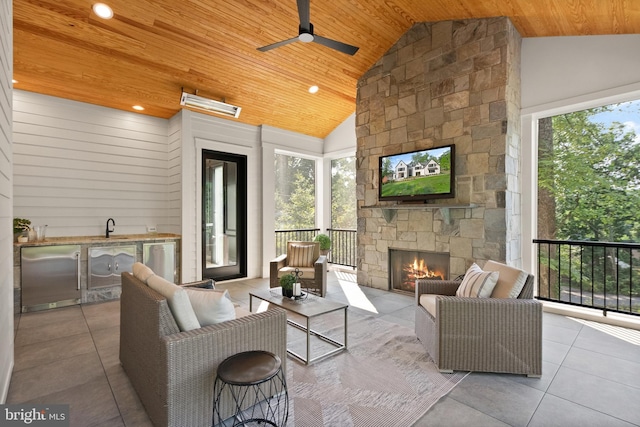 5908 Calla Dr, Mclean, VA 22101 - living area with tile patterned flooring, high vaulted ceiling, an outdoor stone fireplace, wood ceiling, and a ceiling fan