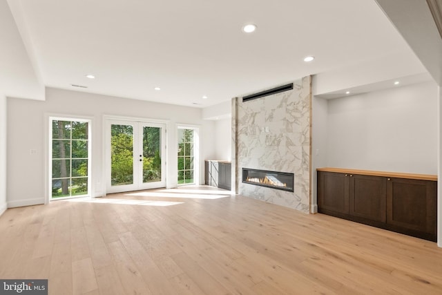 5908 Calla Dr, Mclean, VA 22101 - unfurnished living room featuring a high end fireplace, recessed lighting, light wood finished floors, and a wealth of natural light