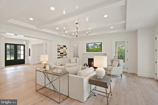 5908 Calla Dr, Mclean, VA 22101 - living area featuring recessed lighting, a chandelier, light wood-style flooring, and a fireplace