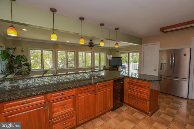 kitchen with stainless steel refrigerator with ice dispenser, pendant lighting, wine cooler, and ceiling fan