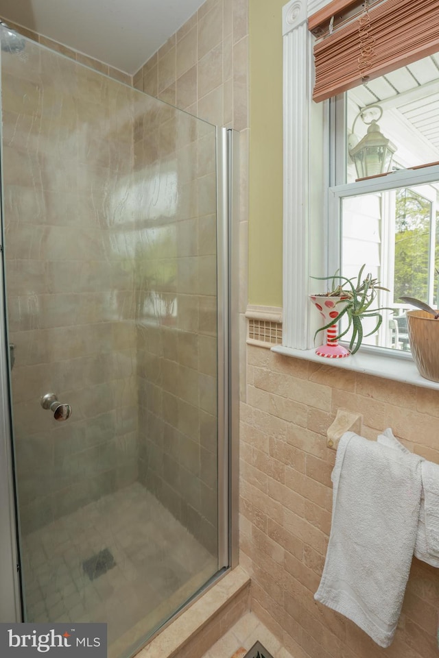 full bath featuring a shower stall