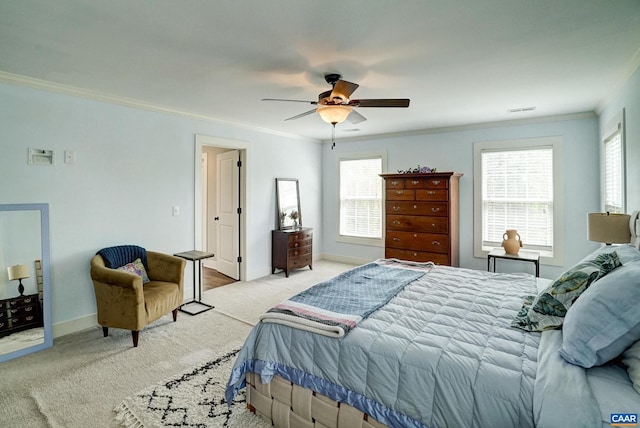 bedroom with baseboards, ornamental molding, ceiling fan, and carpet flooring