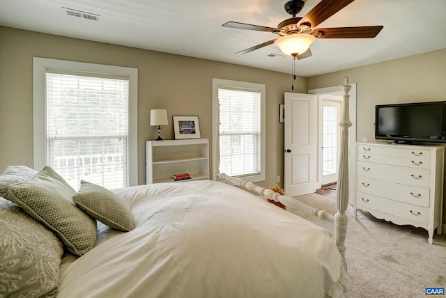 bedroom with ceiling fan, carpet flooring, and visible vents