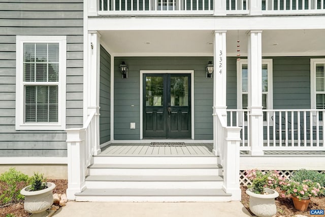 doorway to property featuring a porch