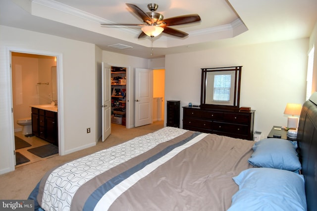 1037 Agricopia Dr, La Plata, MD 20646 - bedroom with a raised ceiling, light carpet, a walk in closet, ornamental molding, and a sink