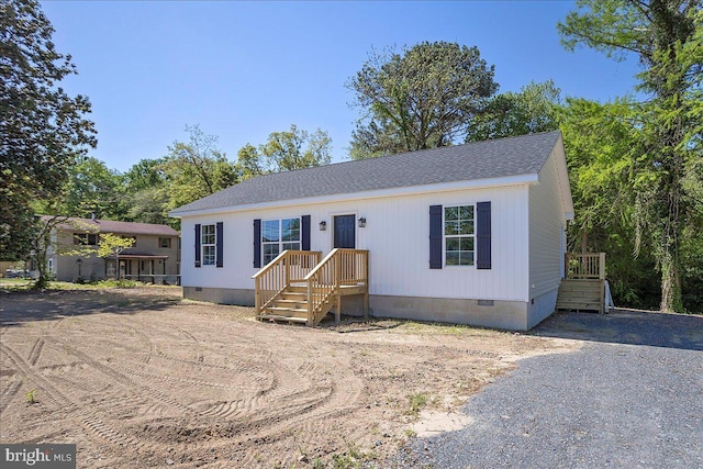 4205 Cabin Creek Hurlock Rd, Hurlock, MD 21643 - manufactured / mobile home featuring a shingled roof and crawl space