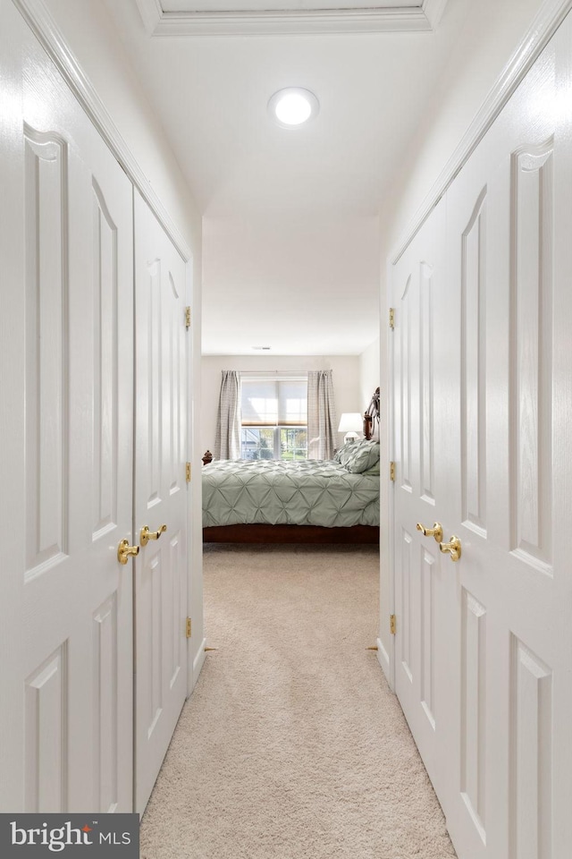 bedroom with light colored carpet