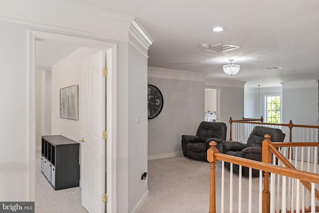 corridor with crown molding, baseboards, visible vents, and light carpet