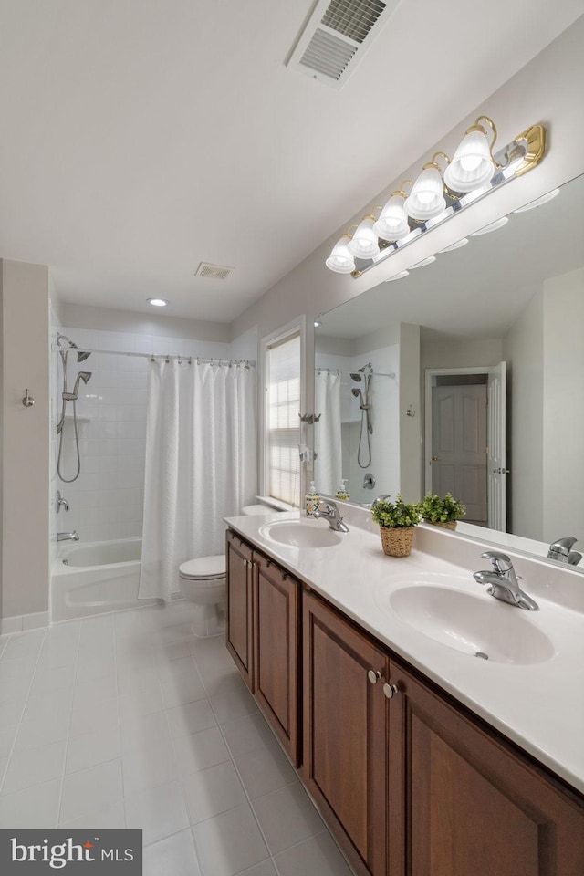full bathroom featuring a sink, tile patterned flooring, toilet, and visible vents