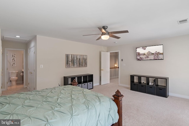 carpeted bedroom featuring visible vents, baseboards, attic access, recessed lighting, and connected bathroom