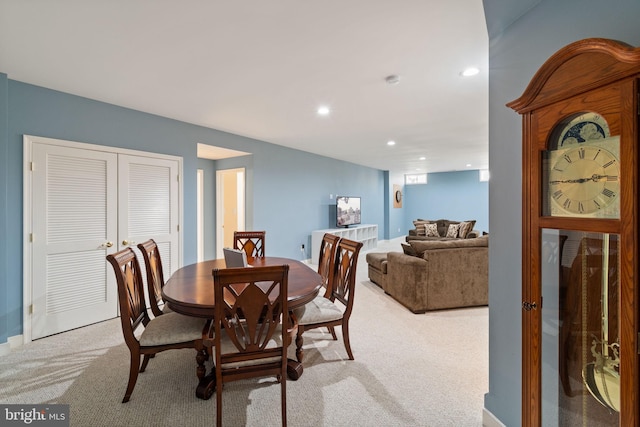 dining room featuring baseboards, recessed lighting, and light colored carpet