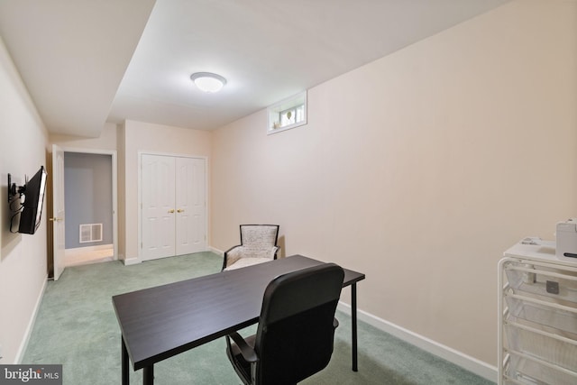 office area with carpet floors, baseboards, and visible vents