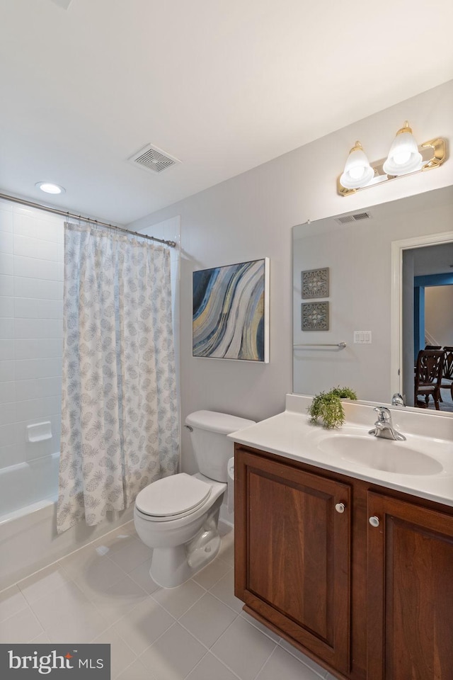 bathroom featuring tile patterned floors, vanity, toilet, and visible vents