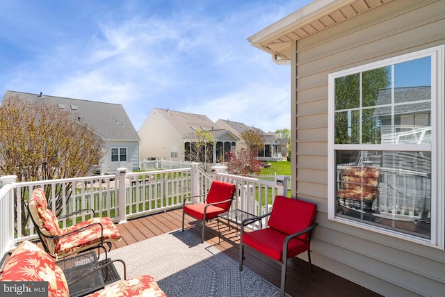 wooden deck featuring a residential view