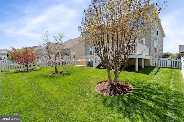 view of yard featuring a fenced backyard and a residential view