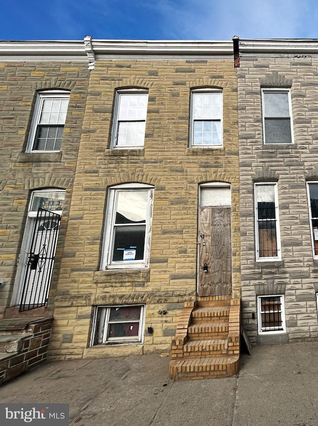 multi unit property with entry steps and stone siding