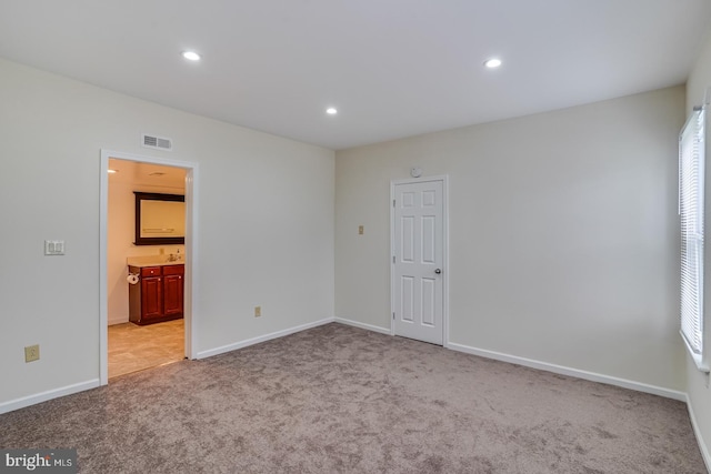 25 E High St, Felton, DE 19943 - unfurnished bedroom with light carpet, recessed lighting, and ensuite bathroom