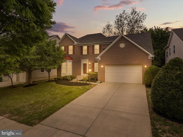 13214 Eldorado Greenfields Dr, Bowie, MD 20720 - view of front facade featuring a shingled roof, an attached garage, brick siding, concrete driveway, and a yard