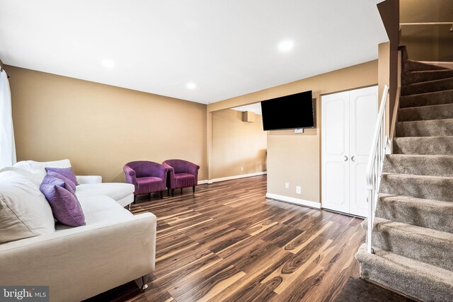 living area featuring baseboards, recessed lighting, stairs, and dark wood-style floors