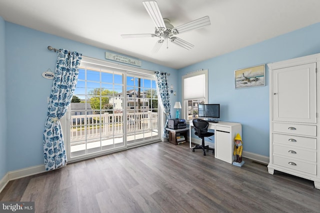 office area featuring baseboards, ceiling fan, and dark wood-style floors