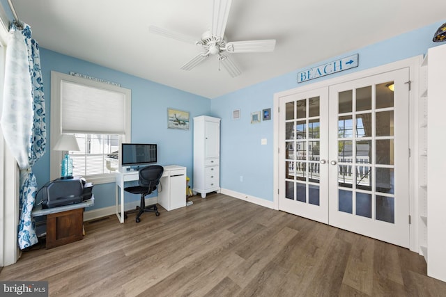 office featuring a ceiling fan, baseboards, french doors, and wood finished floors