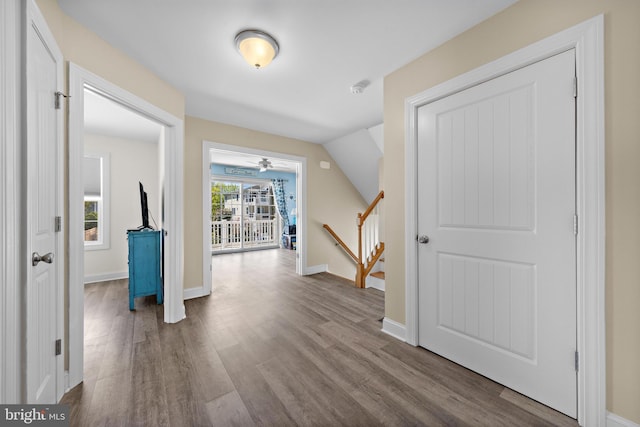 bonus room featuring baseboards, ceiling fan, and wood finished floors