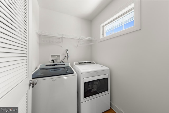 laundry room with washer and dryer and laundry area