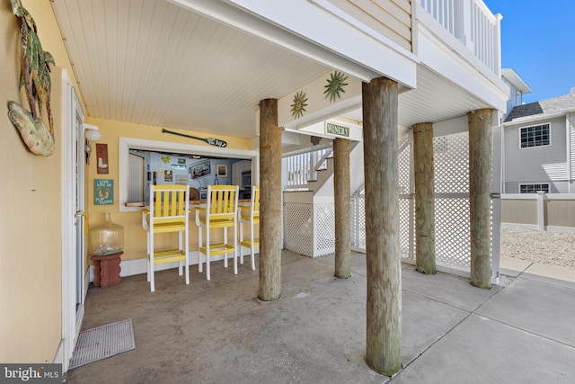 view of patio featuring fence