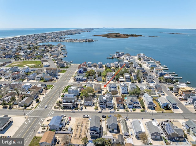 aerial view with a residential view and a water view