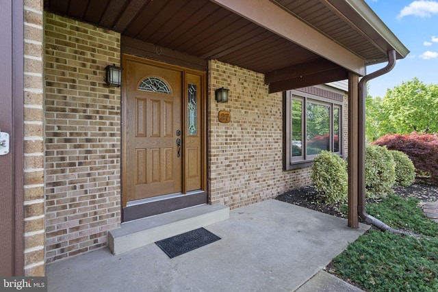 entrance to property with brick siding