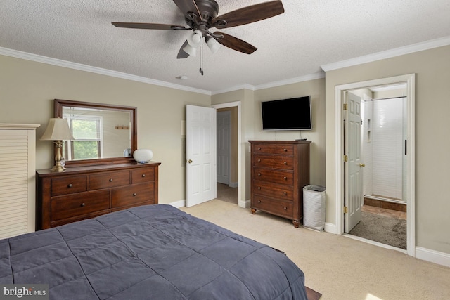 carpeted bedroom with ornamental molding, a textured ceiling, and baseboards