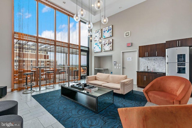 1320 Fenwick Ln Unit 402, Silver Spring, MD 20910 - living area featuring expansive windows and a towering ceiling
