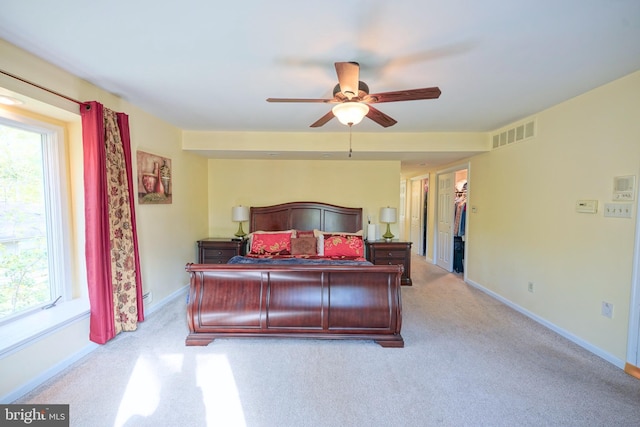 bedroom featuring visible vents, baseboards, carpet floors, and ceiling fan