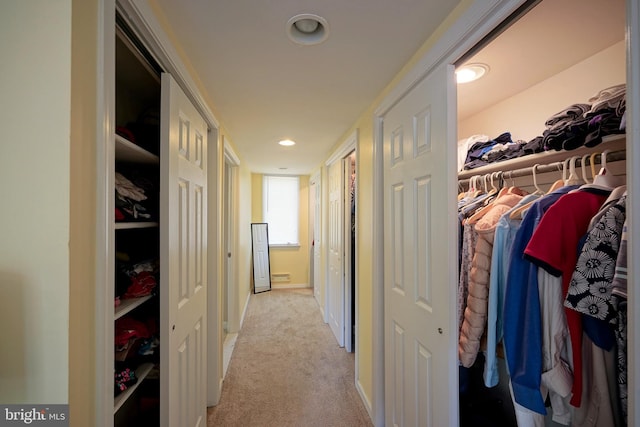 hallway featuring carpet flooring and recessed lighting