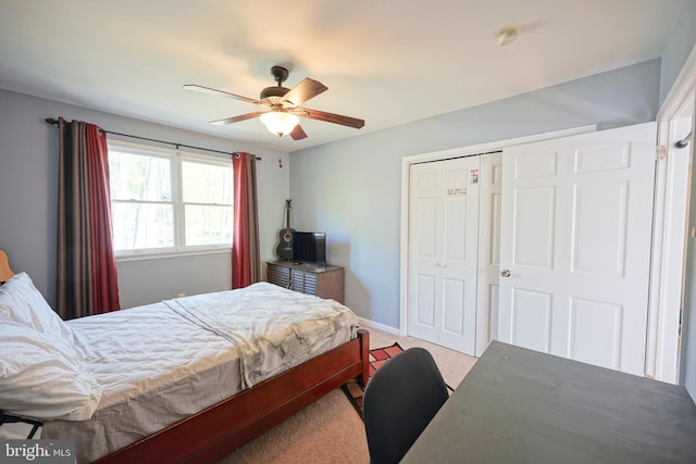bedroom featuring a closet, baseboards, a ceiling fan, and carpet flooring