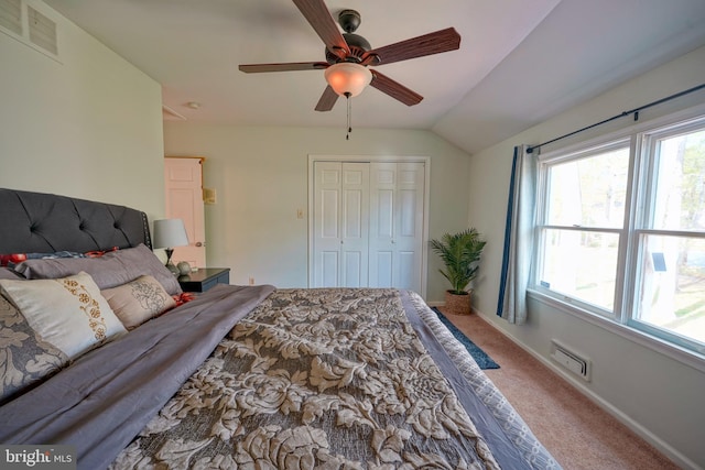 bedroom with vaulted ceiling, ceiling fan, carpet flooring, and visible vents