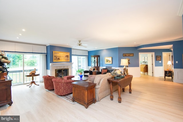 2210 Horns Point Rd, Cambridge, MD 21613 - living room featuring ceiling fan, light wood-style flooring, crown molding, recessed lighting, and a glass covered fireplace