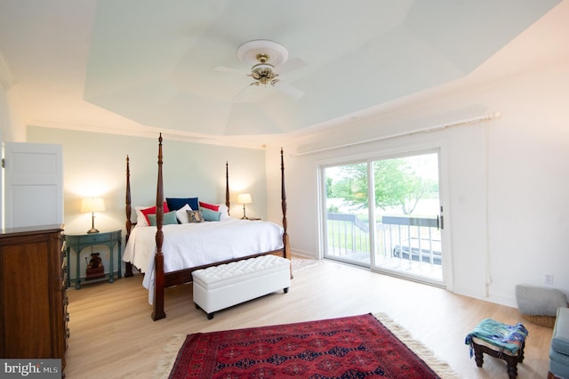 2210 Horns Point Rd, Cambridge, MD 21613 - bedroom with access to exterior, light wood-type flooring, a raised ceiling, and ceiling fan