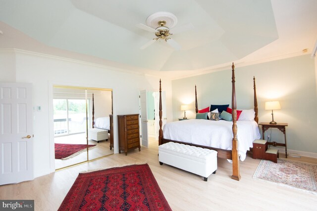 2210 Horns Point Rd, Cambridge, MD 21613 - bedroom with wood finished floors, crown molding, access to outside, a ceiling fan, and a raised ceiling