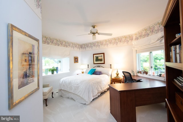 2210 Horns Point Rd, Cambridge, MD 21613 - bedroom with multiple windows, a desk, and a ceiling fan