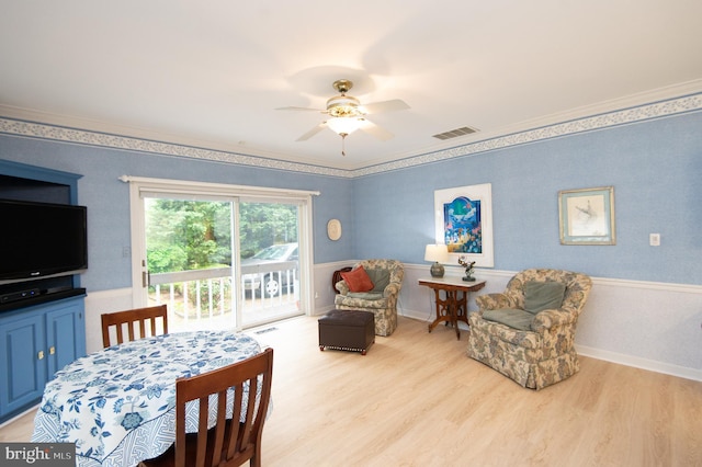 2210 Horns Point Rd, Cambridge, MD 21613 - dining space featuring light wood-style flooring, ceiling fan, and crown molding
